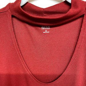 Rust Color Sleeveless Mock neck with deep cut out opening. Medium